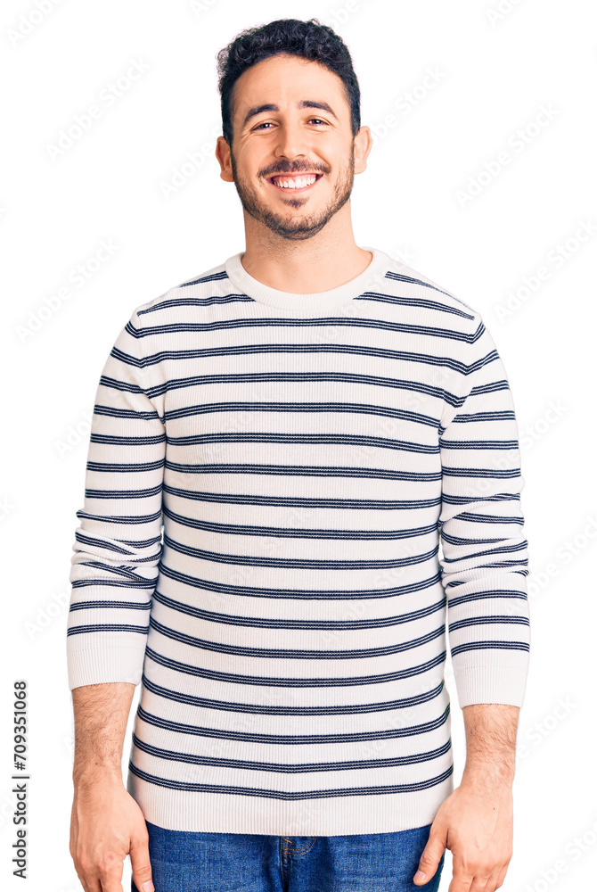 Young hispanic man wearing casual clothes with a happy and cool smile on face. lucky person. Young hispanic man wearing casual clothes with a happy and cool smile on face. lucky person.