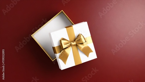 blank gold ribbon bow gift box open or top view of white present box tied with golden bow on dark red background with shadow minimal conceptual 3d rendering © Faith