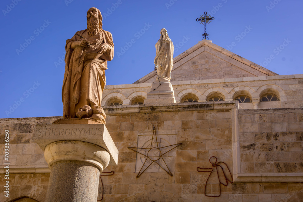 The statue of Jerome of Stridon, the Christian scholar and Bible translator, in front of Church of the Nativity in Bethlehem City, West Bank, Palestine.