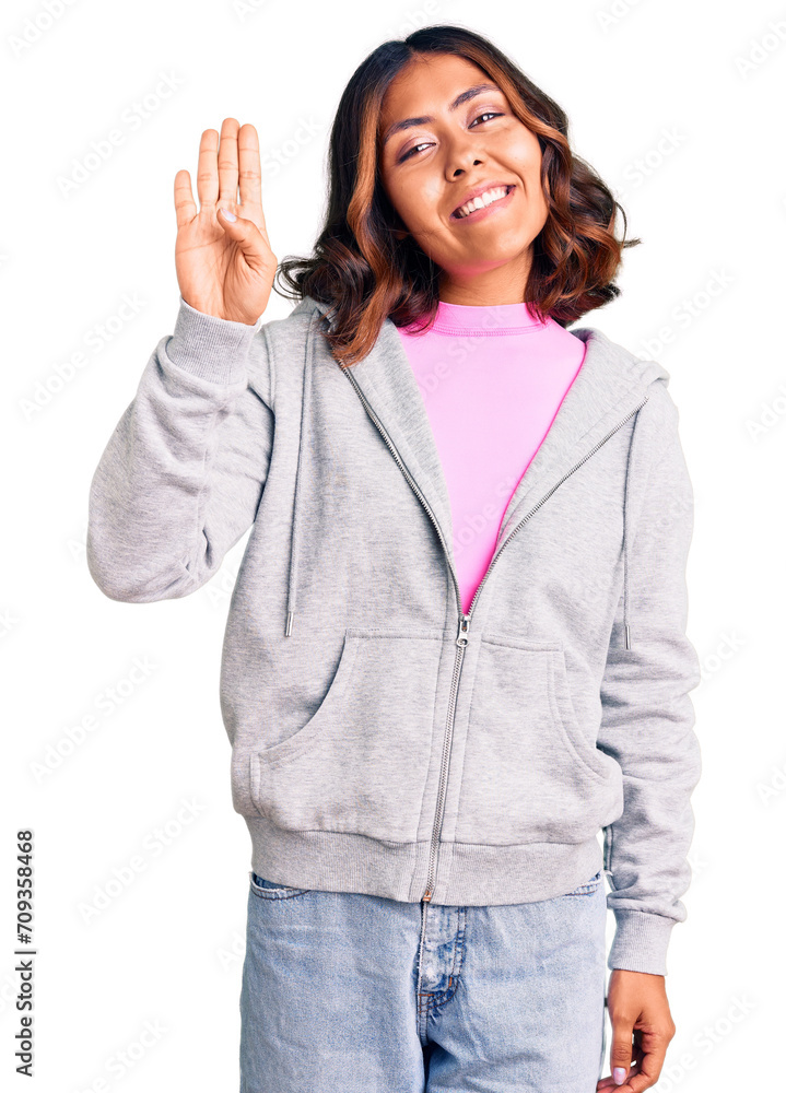 Young beautiful mixed race woman wearing casual sporty clothes showing and pointing up with fingers number four while smiling confident and happy. Young beautiful mixed race woman wearing casual sporty clothes showing and pointing up with fingers number four while smiling confident and happy.