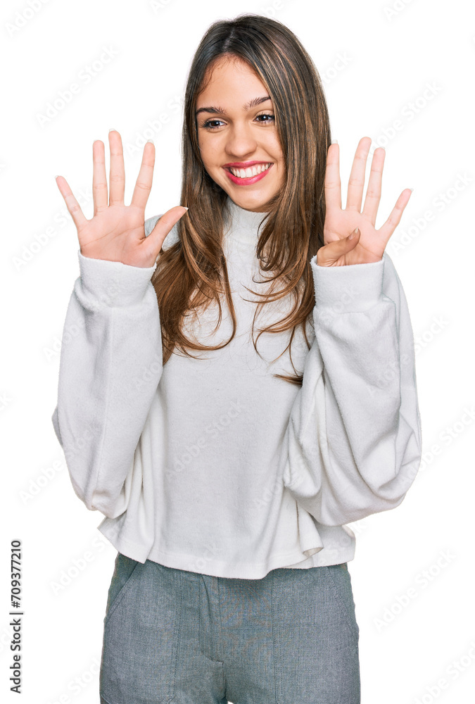 Young brunette woman wearing casual turtleneck sweater showing and pointing up with fingers number nine while smiling confident and happy. Young brunette woman wearing casual turtleneck sweater showing and pointing up with fingers number nine while smiling confident and happy.