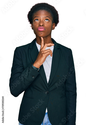 Obraz na plátně Young african american girl wearing business clothes thinking concentrated about