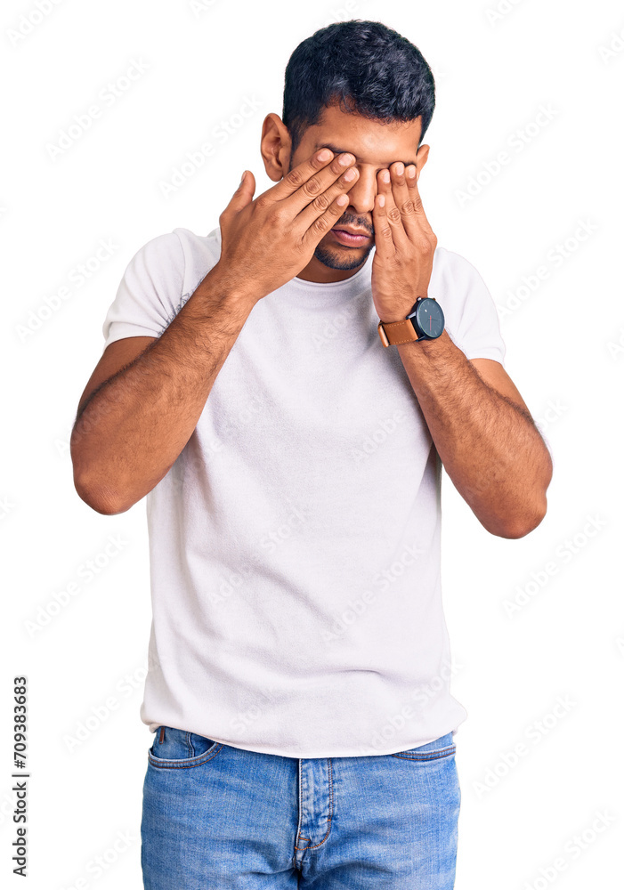Young latin man wearing casual clothes rubbing eyes for fatigue and headache, sleepy and tired expression. vision problem Young latin man wearing casual clothes rubbing eyes for fatigue and headache, sleepy and tired expression. vision problem