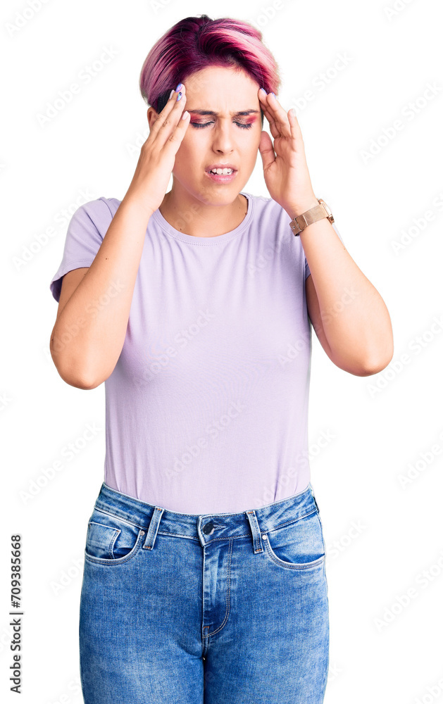 Young beautiful woman with pink hair wearing casual clothes with hand on head for pain in head because stress. suffering migraine. Young beautiful woman with pink hair wearing casual clothes with hand on head for pain in head because stress. suffering migraine.