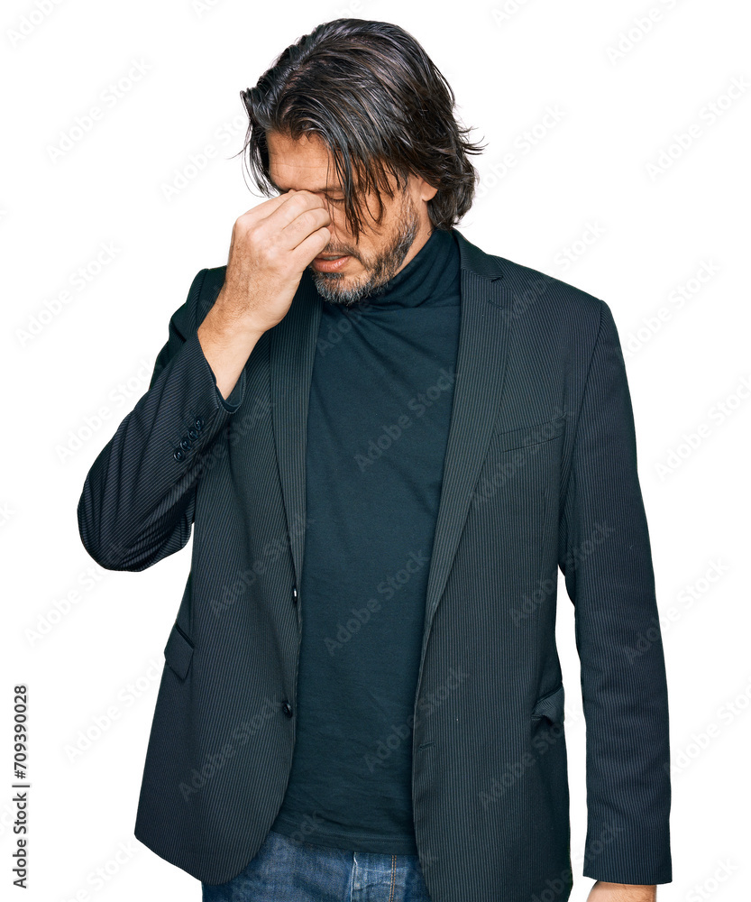 Middle age handsome man wearing business clothes tired rubbing nose and eyes feeling fatigue and headache. stress and frustration concept. Middle age handsome man wearing business clothes tired rubbing nose and eyes feeling fatigue and headache. stress and frustration concept.