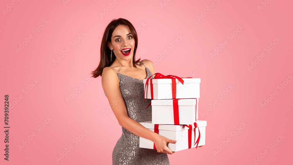 An overjoyed woman with wide eyes and a bright smile, dressed in a glittery silver dress An overjoyed woman with wide eyes and a bright smile, dressed in a glittery silver dress