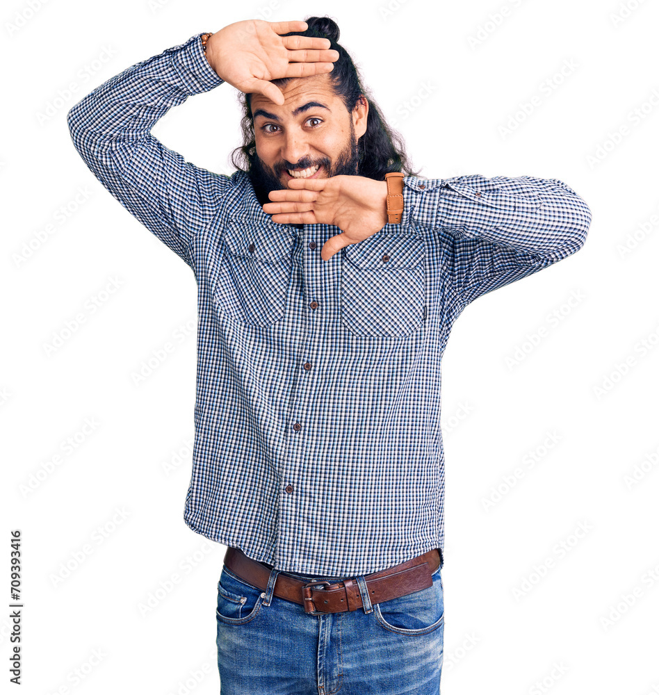Young arab man wearing casual clothes smiling cheerful playing peek a boo with hands showing face. surprised and exited Young arab man wearing casual clothes smiling cheerful playing peek a boo with hands showing face. surprised and exited