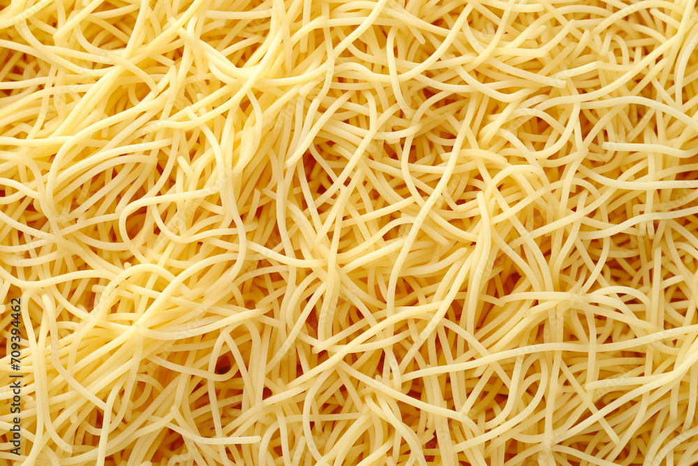 Close up of spaghetti noodles, thin and yellow Close up of spaghetti noodles, thin and yellow