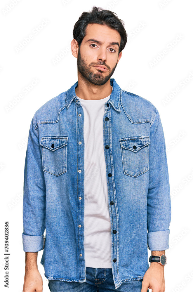 Young hispanic man wearing casual clothes looking sleepy and tired, exhausted for fatigue and hangover, lazy eyes in the morning. Young hispanic man wearing casual clothes looking sleepy and tired, exhausted for fatigue and hangover, lazy eyes in the morning.