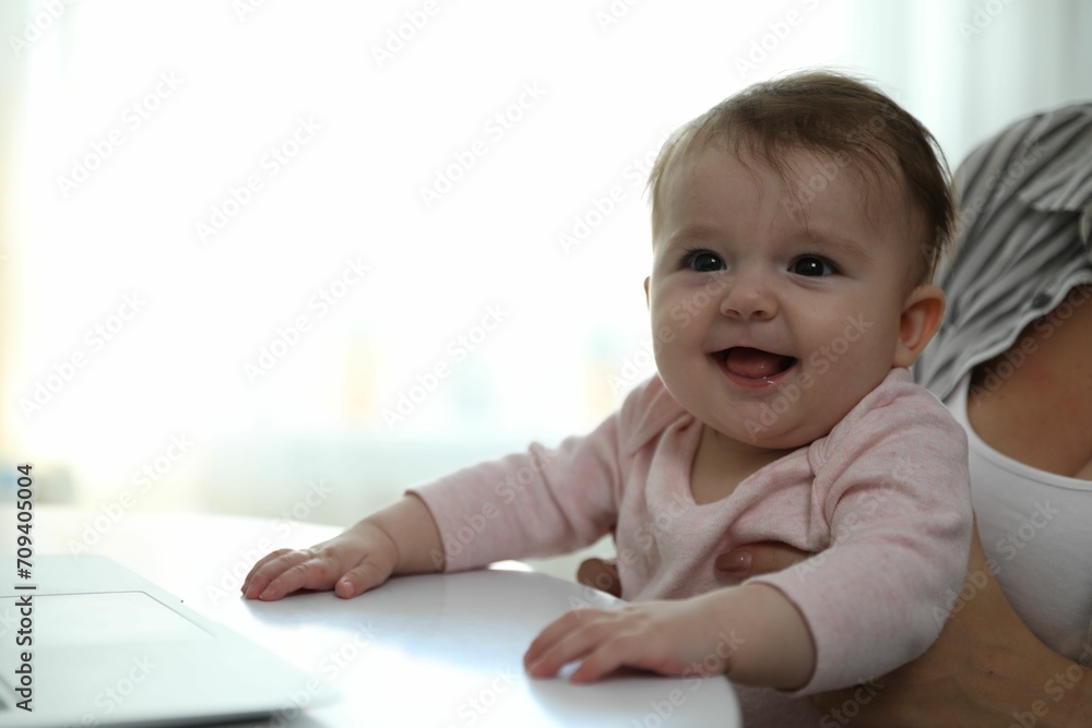 Young woman with her cute baby at home Young woman with her cute baby at home