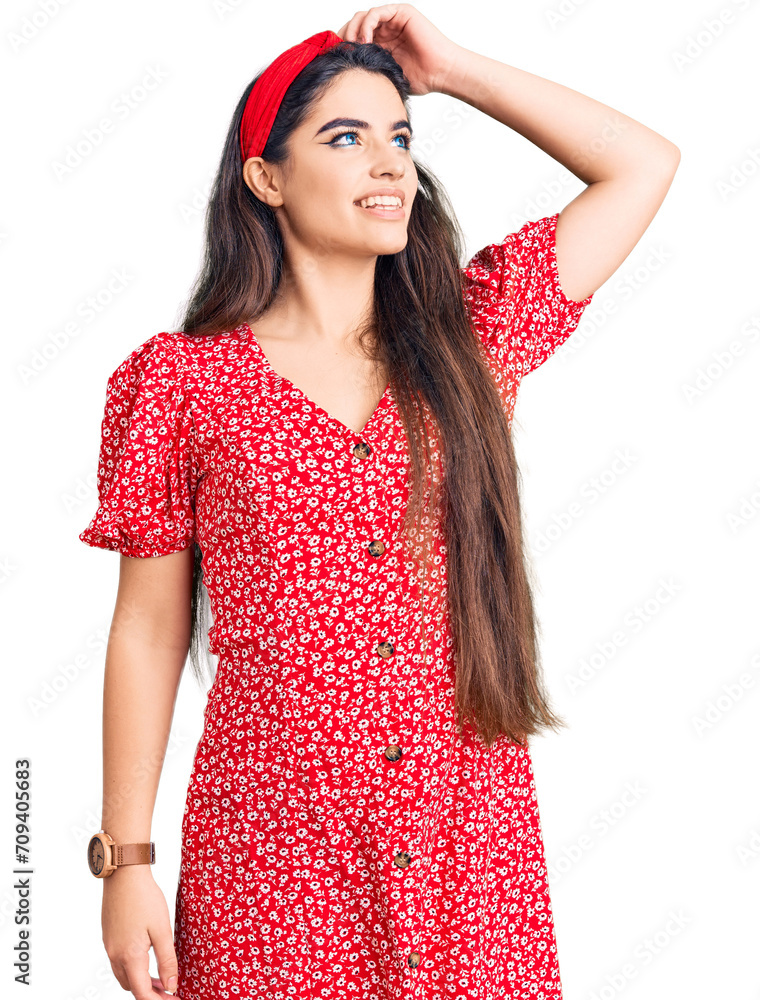 Brunette teenager girl wearing summer dress smiling confident touching hair with hand up gesture, posing attractive and fashionable Brunette teenager girl wearing summer dress smiling confident touching hair with hand up gesture, posing attractive and fashionable