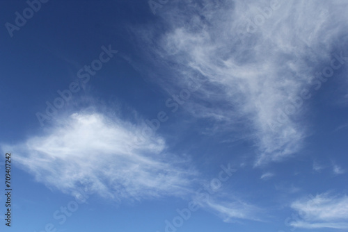Wispy white clouds cloudscape in a blue sky