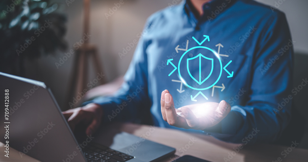 Naklejka premium technology, digital, security, artificial, innovation, intelligence, shield, learning, machine, reflect. close up of businessman and hand holding shield hologram with arrow. to means secure, safety
