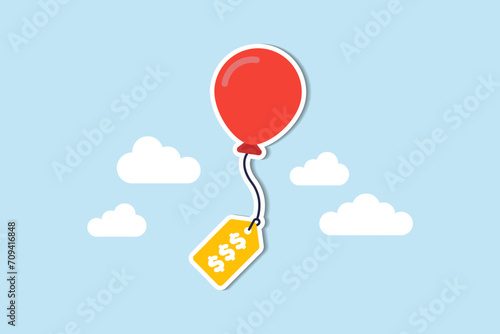 Inflation causing price rising up, overvalued stock or funds, consumer purchasing power reducing concept, air balloon tied with product price tag flying high rising up in the sky.