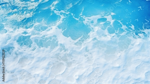 pale blue sea surface with waves splash white foam
