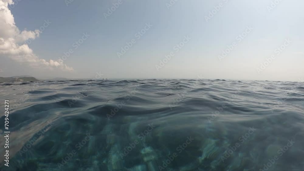 water wave surface of outdoor swimming pool in summertime, motion scene with cloud in the sky water wave surface of outdoor swimming pool in summertime, motion scene with cloud in the sky