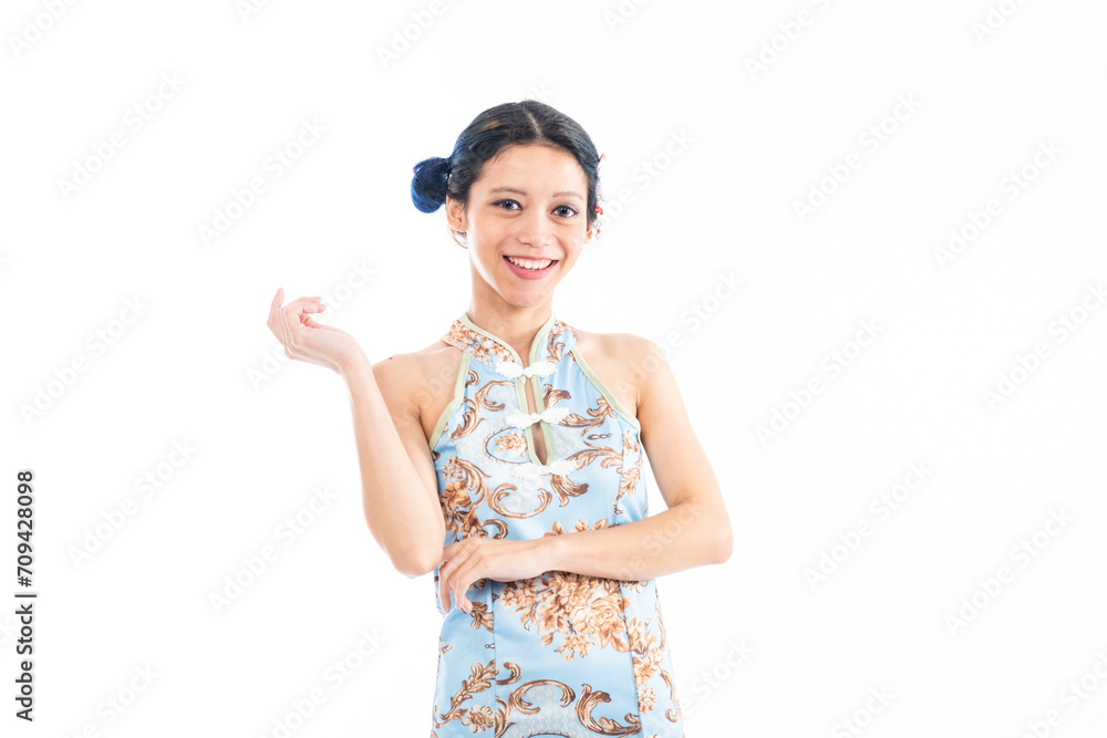 Portrait of an attractive Asian Chinese female wearing cheongsam or qipao isolated on white background for Chinese New Year concept Portrait of an attractive Asian Chinese female wearing cheongsam or qipao isolated on white background for Chinese New Year concept