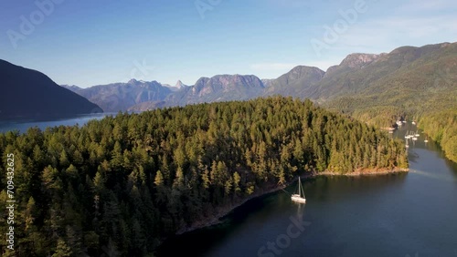 Sailboat anchored in mountain bay in Desolation Sound, Canada