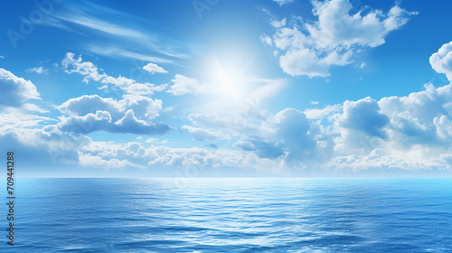 blue sea or ocean with sunny and cloudy sky