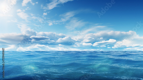 blue sea or ocean with sunny and cloudy sky