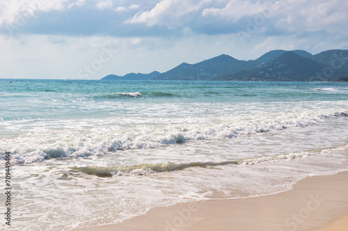 KOH SAMUI  THAILAND - JANUARY 14 2024  Beautiful beach. View of nice tropical beach with white sand  blue sea and blue sky. Holiday and vacation concept. Tropical beach Chaweng Noi beach  Samui.