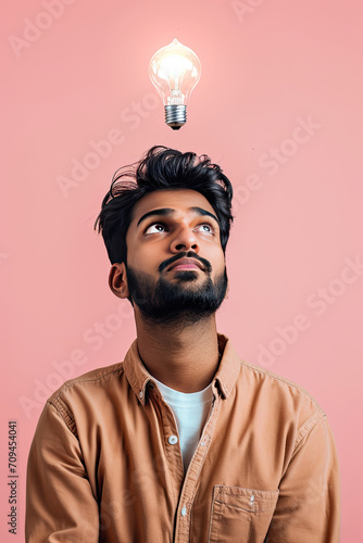 A thinking Indian man with a lightbulb on his head