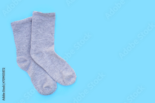 Grey socks on blue background.
