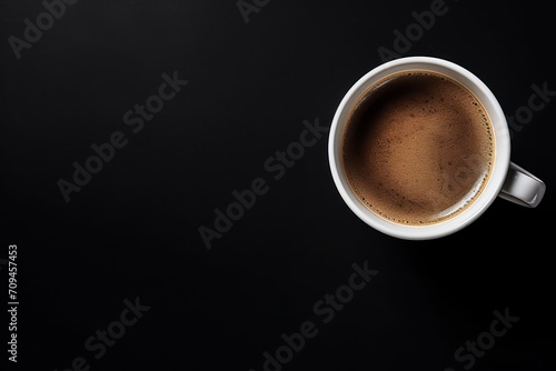 Cup of coffee on black background. Copy space. Top view. Flat lay. 