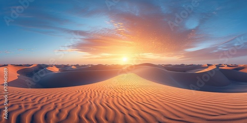 panoramic view of a vast desert under a blazing sunset  with sand dunes creating beautiful patterns.