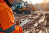  a engineer using a digital tablet on a construction site. 