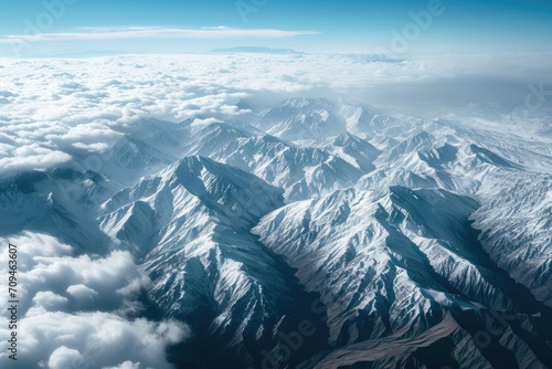 A breathtaking aerial view of a mountain range Showcasing the grandeur and scale of nature's landscapes
