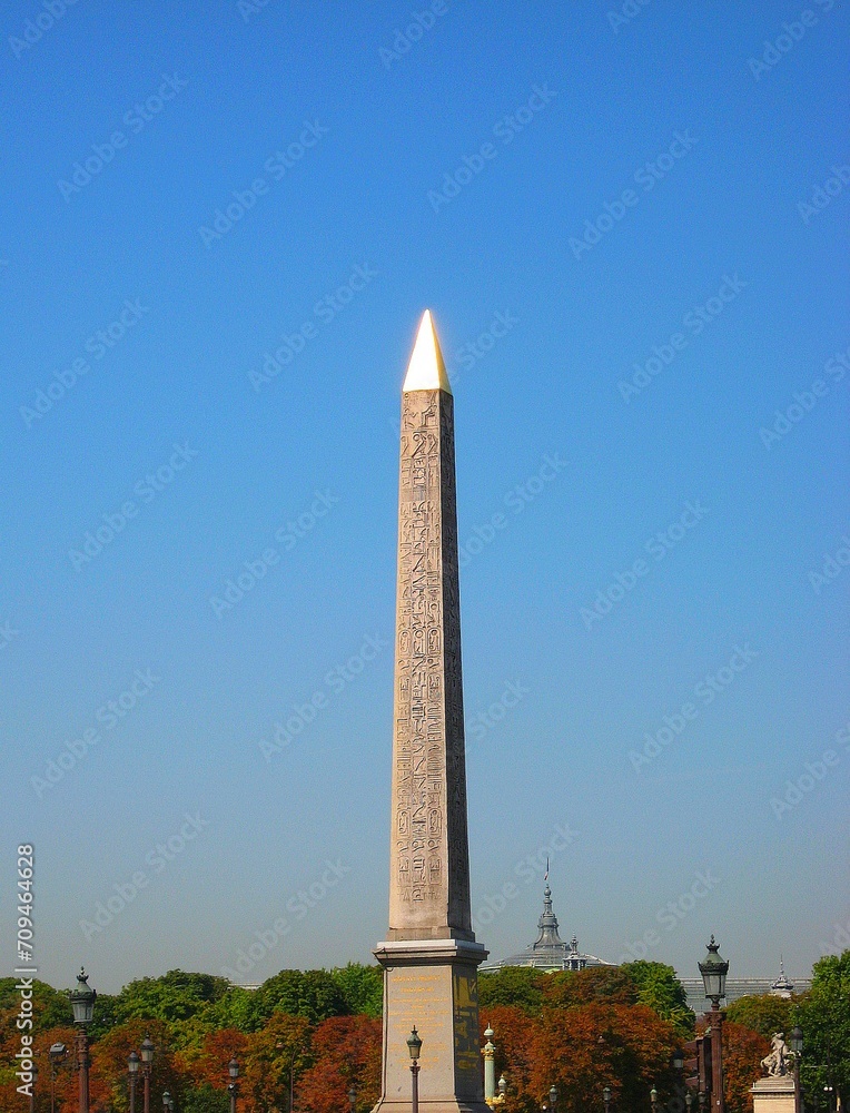 Luxor Obelisk at place de la concorde under the blue sky in summer in Paris, France