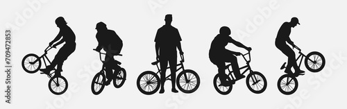 Set of silhouettes of BMX cyclist. Isolated on white background. Graphic vector illustration.
