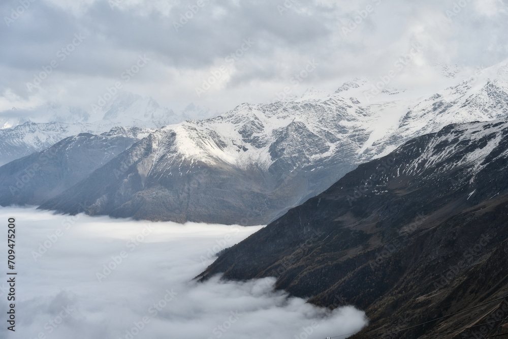 Sea of clouds floods the Azau Glade near the Mount Elbrus