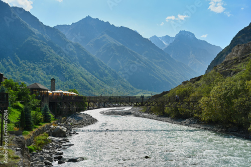 Suspension bridge over the Terek River in the village of Upper Balkaria photo