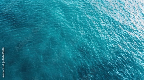 Blue sea water surface texture background. Top view of sea water surface