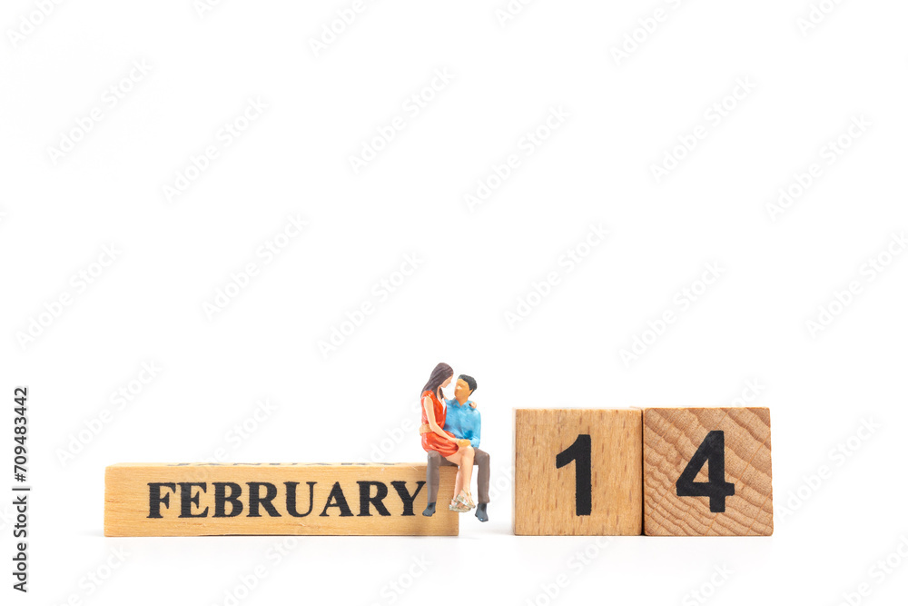Miniature Couple sitting together on white  background , Valentine's day concept