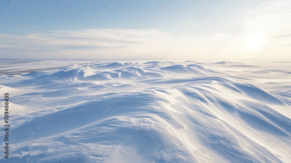 Winter landscape with snowdrifts and blue sky.
