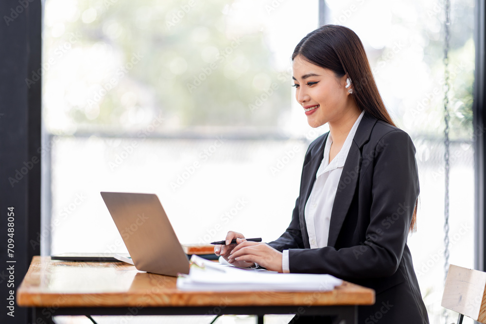 Asian businessman hand using calculator and working with laptop calculate about finance accounting at workplace.finance accounting concept Asian businessman hand using calculator and working with laptop calculate about finance accounting at workplace.finance accounting concept