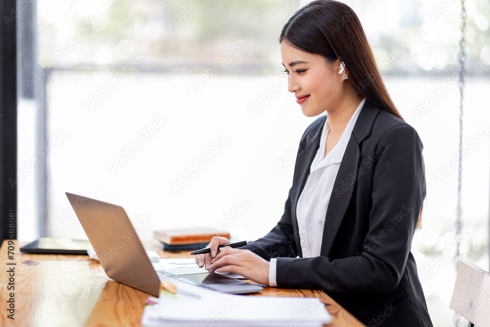 Asian businessman hand using calculator and working with laptop calculate about finance accounting at workplace.finance accounting concept Asian businessman hand using calculator and working with laptop calculate about finance accounting at workplace.finance accounting concept