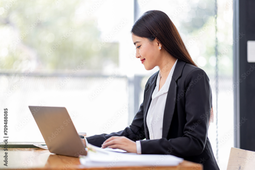 Asian businessman hand using calculator and working with laptop calculate about finance accounting at workplace.finance accounting concept Asian businessman hand using calculator and working with laptop calculate about finance accounting at workplace.finance accounting concept