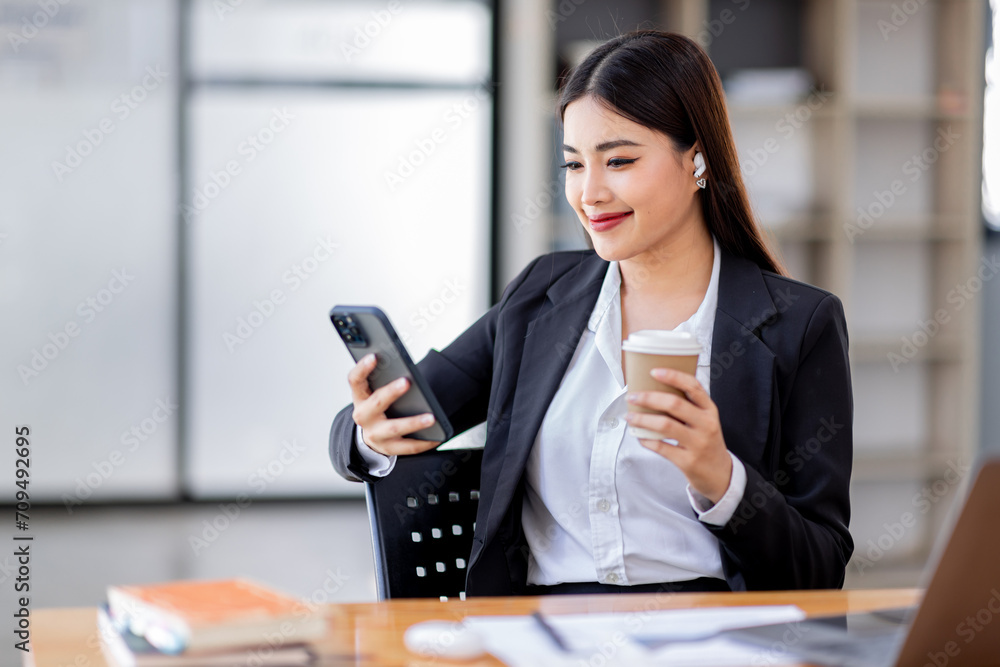 Business Asian woman hold phone and use laptop at the workplace. Project stats financial data sales charts on laptop and cellphone Asian finance concept
Business Asian woman hold phone and use laptop at the workplace. Project stats financial data sales charts on laptop and cellphone Asian finance concept