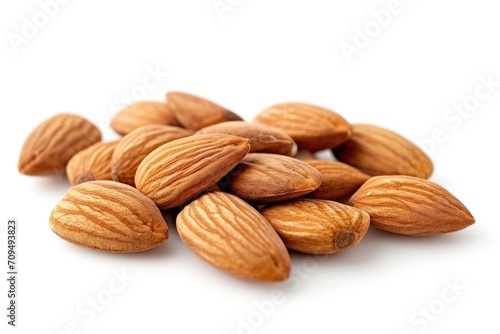 Organic almonds over white background.