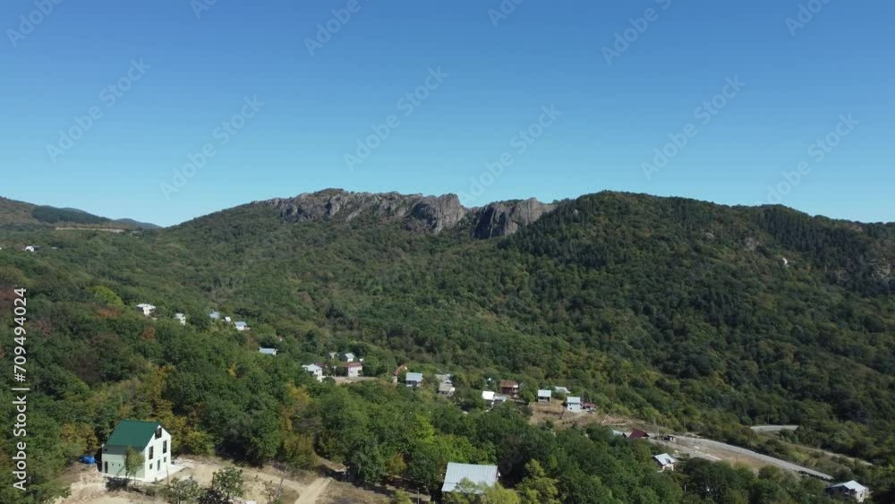 4K Drone Shot Reveals Enchanting Traditional Georgian Village Surrounded by Lush Green Forest in Kvemo Kartli Region; Birtvisi Canyon Creates a Stunning Backdrop Showcasing Historical Significance. 4K Drone Shot Reveals Enchanting Traditional Georgian Village Surrounded by Lush Green Forest in Kvemo Kartli Region; Birtvisi Canyon Creates a Stunning Backdrop Showcasing Historical Significance.