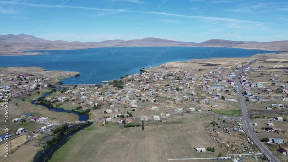 Discover Paravani, largest lake in Georgia, Samtskhe-Javakheti region. 4K drone shot captures the stunning sunset over this volcanic landscape, also known as Georgian Arctic. Discover Paravani, largest lake in Georgia, Samtskhe-Javakheti region. 4K drone shot captures the stunning sunset over this volcanic landscape, also known as Georgian Arctic.
