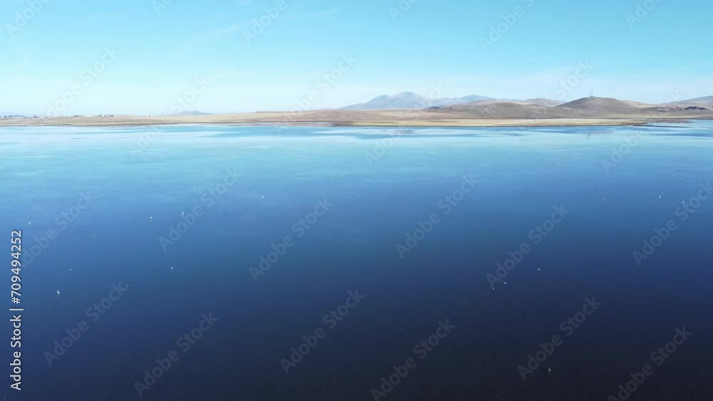 Discover Madatapa Lake in Samtskhe-Javakheti region, Georgia. 4K drone shot captures the stunning sunset over this volcanic landscape, also known as Georgian Arctic. Perfect for birdwatching Discover Madatapa Lake in Samtskhe-Javakheti region, Georgia. 4K drone shot captures the stunning sunset over this volcanic landscape, also known as Georgian Arctic. Perfect for birdwatching