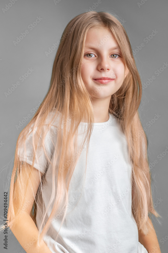 Fototapeta premium Portrait of cute little girl with long light hair