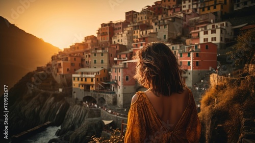 Rear view of woman watching sunset on Amalfi coast, woman traveling in Italy in summer, woman looking at scenery in Italy, faceless travel footage, summer travel, travel in Europe