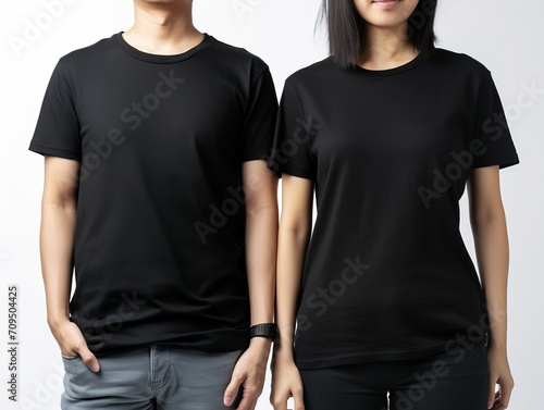 Man and woman wearing black t-shirts, couple style black t-shirt mockup, faceless male and female female models showing black t-shirts on white background, mockup template for design print