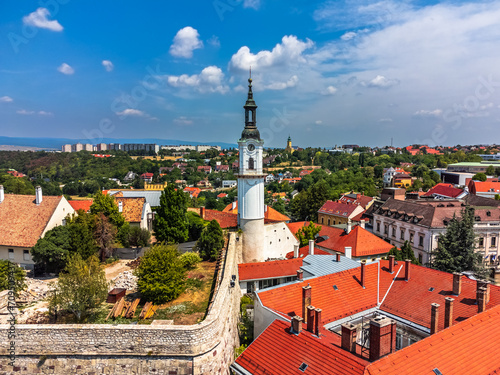 Veszprem, Hungary - Aerial view of the Fire-watch tower at Ovaros square, castle district of Veszprem with Saint Margaret's Church and medieval buildings at background on a sunny summer day, blue sky